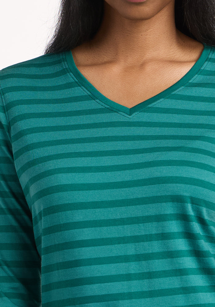 Person wearing Woolx Elena 3/4 Sleeve V Neck in Woodland Stripe; only the neck and upper chest are visible.