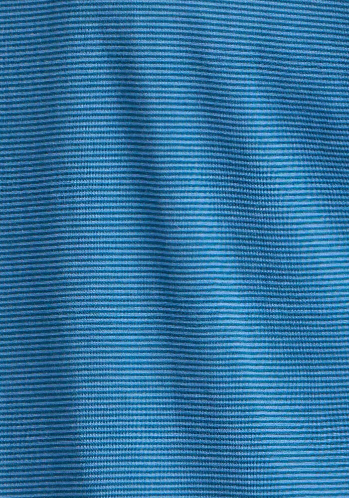 Close-up of the Woolx Essential Tee - Coastal Mini Stripe's blue fabric, showcasing fine horizontal ribbed texture and subtle folds—perfect for a temperature-regulating, lightweight athletic tee.
