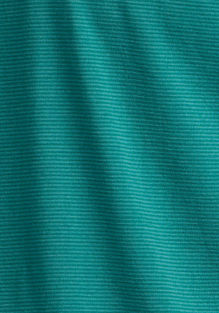 Close-up of the green ribbed fabric and soft folds of the Woolx Essential Tee - Woodland Mini Stripe, showcasing its fine lines and texture typical of a lightweight, comfortable athletic shirt.